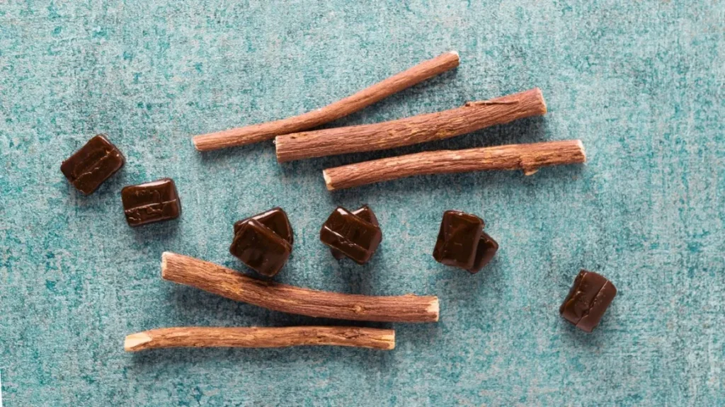 A group of licorice sticks on a blue background.