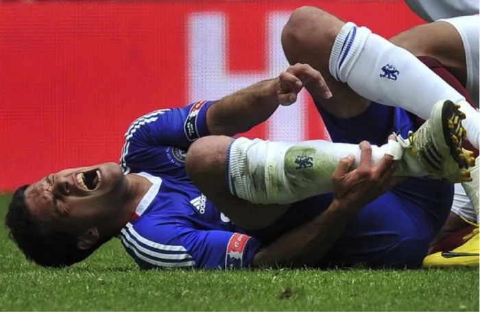A chelsea player suffering from an ankle injury.