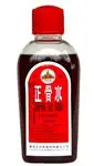 A ZHENG GU SHUI - LARGE (3.4 FL OZ) bottle of red liquid on a white background.