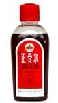 A ZHENG GU SHUI - LARGE (3.4 FL OZ) bottle of red liquid on a white background.
