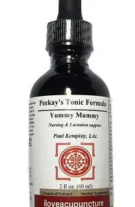A bottle of YUMMY MUMMY therapeutic formula.