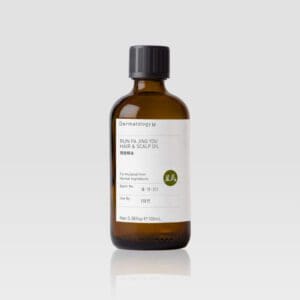 A bottle of RUN FA JING YOU HAIR & SCALP OIL - DERMATOLOGY M on a white background.