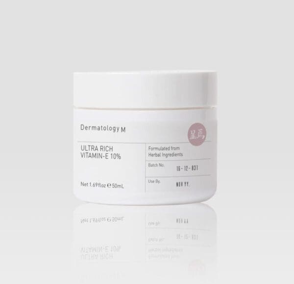 A jar of ULTRA RICH VITAMIN E 10% - DERMATOLOGY M cream on a white background.