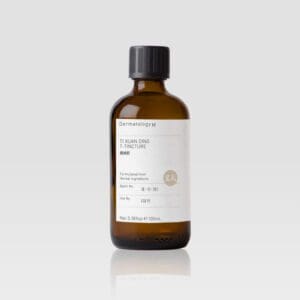 A bottle of TI XUAN DING T-TINCTURE - DERMATOLOGY M on a white background.